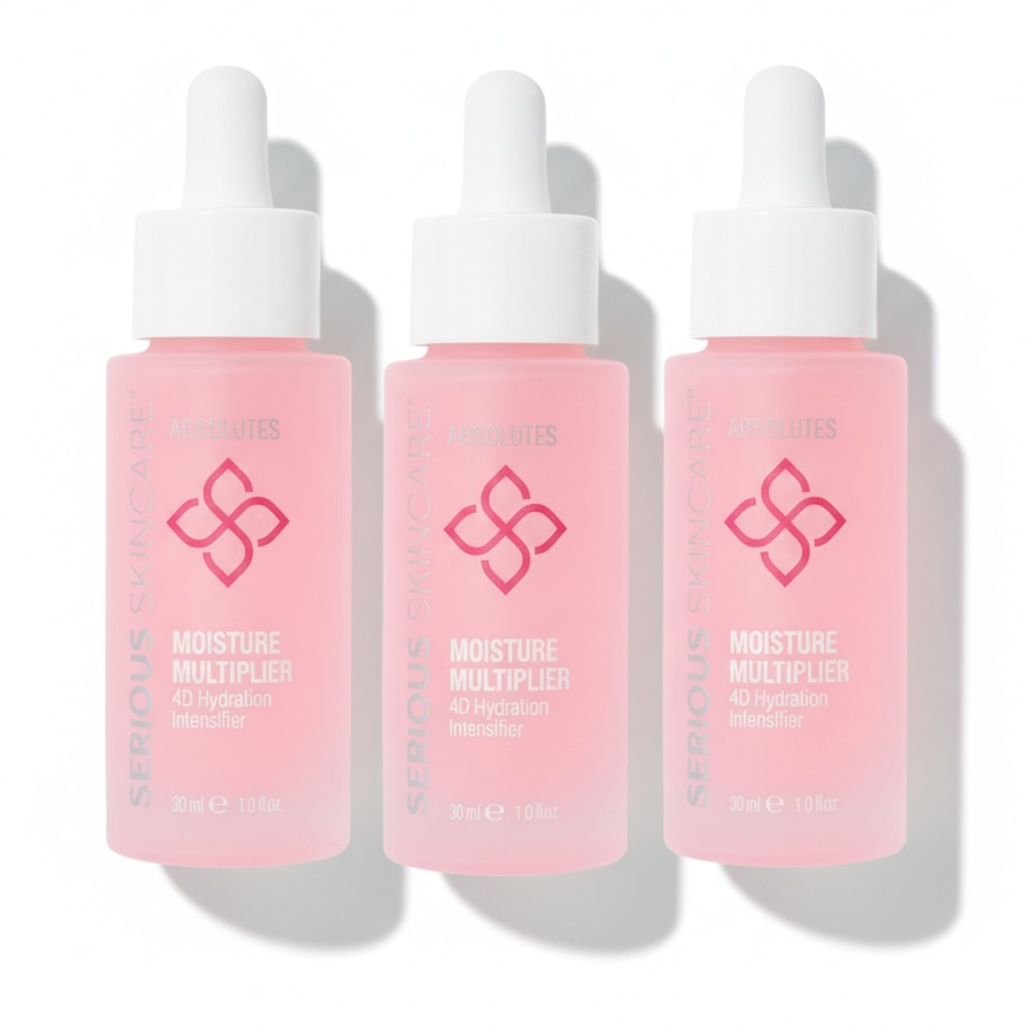 Three bottles of Serious Skincare Moisture Multiplier on a white background.
