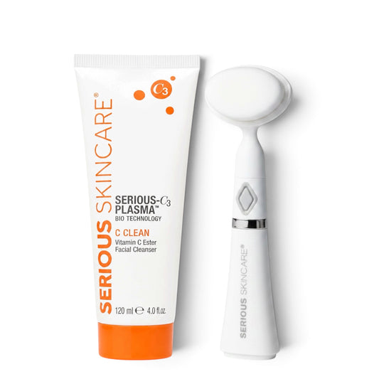 A tube of Serious Skincare Serious C cleanser next to a plush brush.  Serious Skincare C Clean Vitamin C facial cleanser with FREE Plush Cleansing Brush gently removes makeup and impurities while leaving skin soft, hydrated, and radiant.