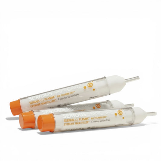 Three medical syringes with orange caps on a white background.  C Extreme Maxi Filler trio