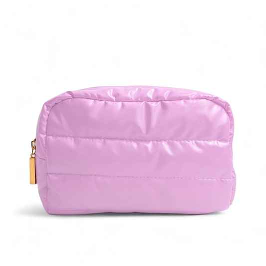 Pink quilted pouch with a gold zipper on a white background
