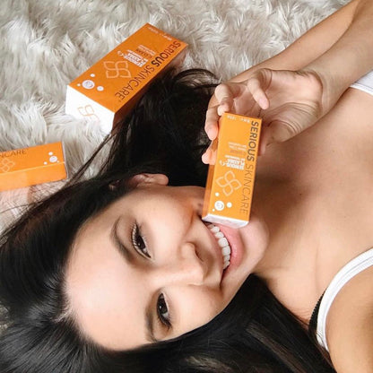 Female modeling showing off Serious Skincare's vitamin C skincare line