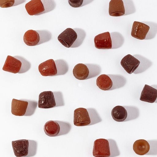 Retinol gummies scattered around to display flavor variety