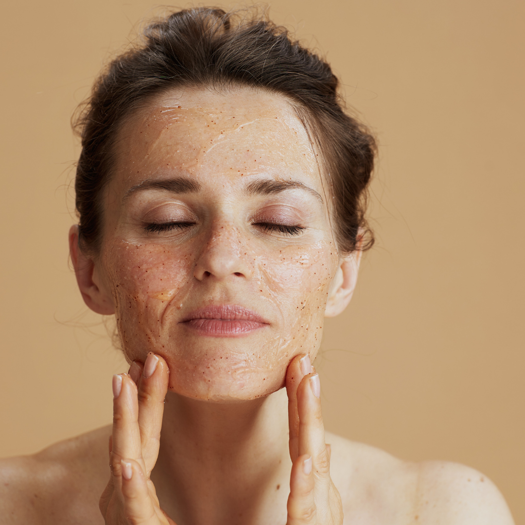 Woman gently applying the phyto pumpkin facial scrub by Serious Skincare 